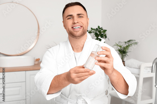Young man with cosmetic pro...