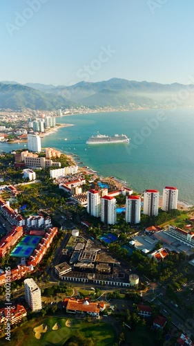 Cruise ship departing from the Puerto Vallarta marina at sunset. Jalisco, Mexico