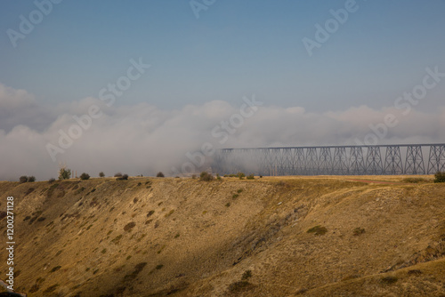 Fotografie High level bridge in Lethbridge, Alberta covered in a morning fog