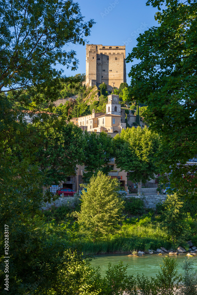 Crest, in the Drôme department, southeastern France, and the Drôme river. The medieval town was built in an amphiteatre shape at the foot of a rocky crest, looked down on by the medieval Tower. Crest, in the Drôme department, southeastern France, and the Drôme river. The medieval town was built in an amphiteatre shape at the foot of a rocky crest, looked down on by the medieval Tower.