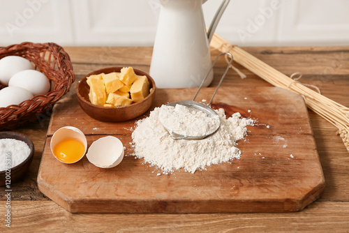 Baking ingredients on woode...