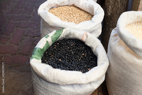 Beans for sale at a stand. Legume seed rich in nutrients such as proteins, fibers, vitamins, minerals and essential amino acids. photo