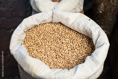 Beans for sale at a stand. Legume seed rich in nutrients such as proteins, fibers, vitamins, minerals and essential amino acids. photo