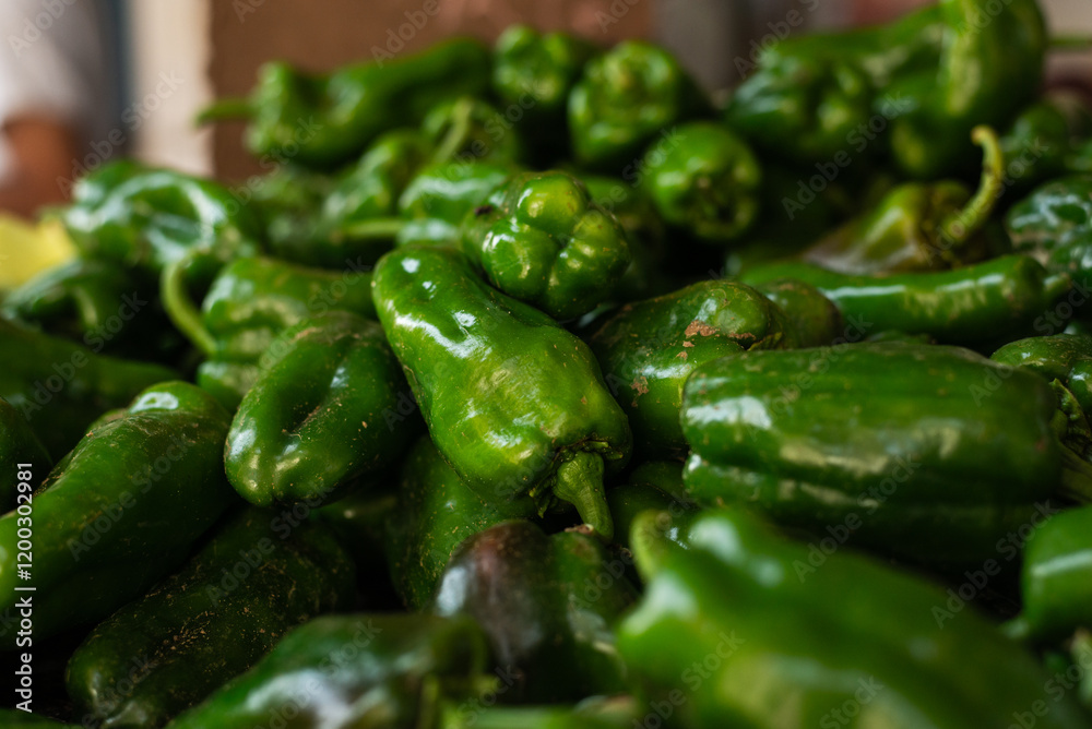 Peppers for sale at a market. Vegetable rich in vitamins C and A. Sources of iron, calcium and phosphorus. Peppers for sale at a market. Vegetable rich in vitamins C and A. Sources of iron, calcium and phosphorus.