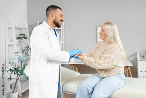 Male doctor with mature wom...