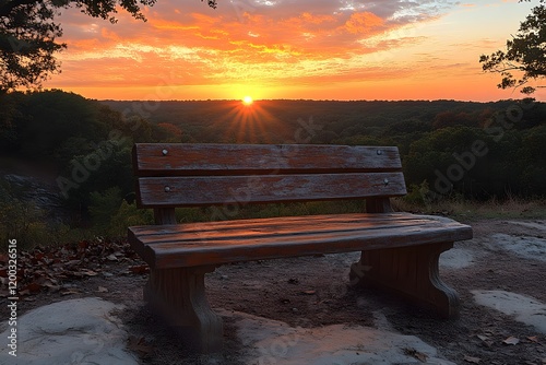 Serene Sunset Overlook with Rustic Bench in Autumn Woodland Setting photo