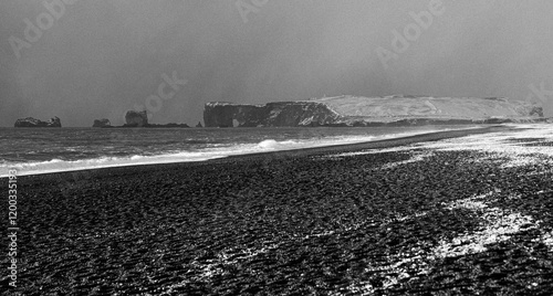 Black beach in Icaland in the winter photo