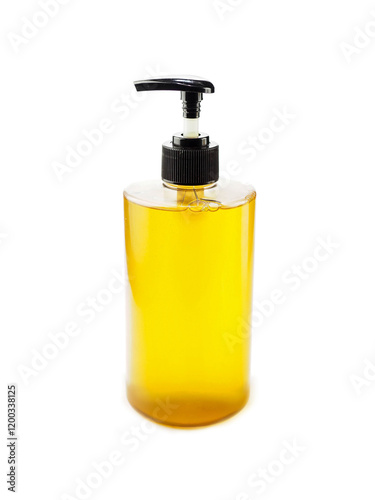Bottle of soap dispenser filled with golden color soap on white background. High quality hygiene product presentation. Liquid stuff for beauty care.