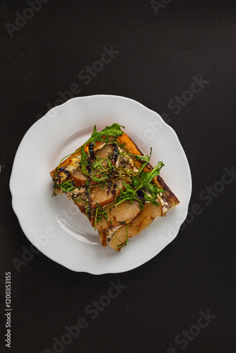 Rotten mandarin with mold and spoiled appearance on a white plate photo