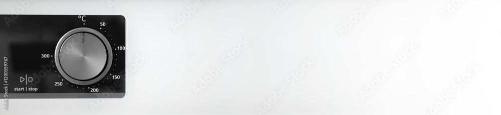 Woman adjusting modern white oven in kitchen. Female hand pushing and turning knobs on oven control panel. Long banner Woman adjusting modern white oven in kitchen. Female hand pushing and turning knobs on oven control panel. Long banner