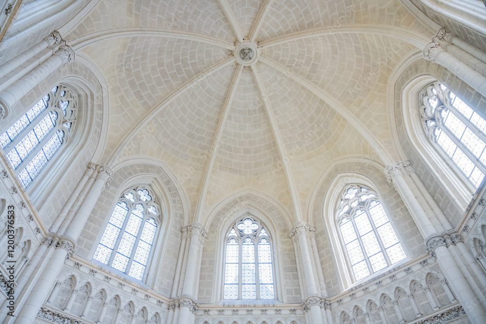Fototapeta premium The striking interior of the Schwarzenberg Tomb showcases intricate architecture with high vaulted ceilings and stained glass windows in Domanin, Czechia. This historic site is a serene resting place.
