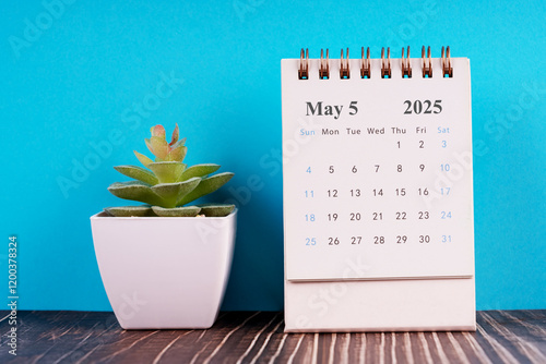2025 May desk calendar flat lay photo