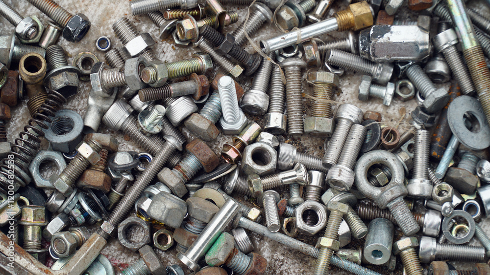 Nuts and bolts scattered around in disarray Nuts and bolts scattered around in disarray
