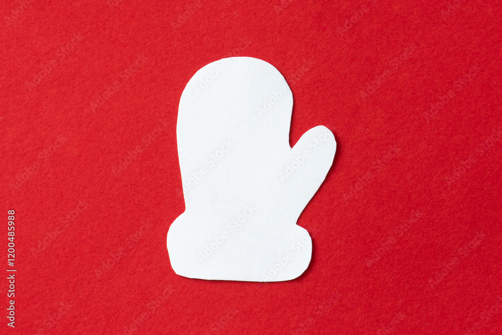 Fototapeta premium Winter glove in paper cut out craft