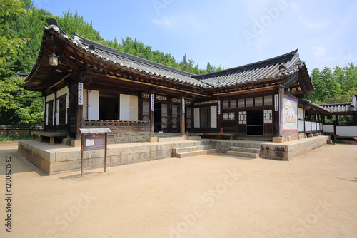 Giheung-gu, Yongin-si, Gyeonggi-do, South Korea - May 1, 2024: Summer view of yard and tile-roofed house with stairs and window door at Korean Folk Village photo