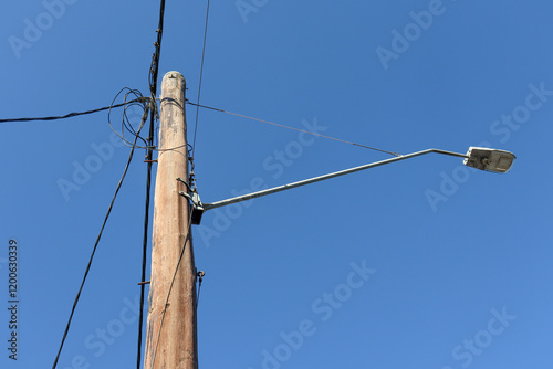 electric pole with wires and light photo