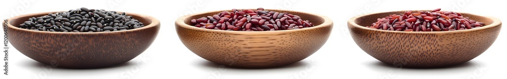 Three wooden bowls filled with black, red, and purple rice grains, isolated on white background. Three wooden bowls filled with black, red, and purple rice grains, isolated on white background.