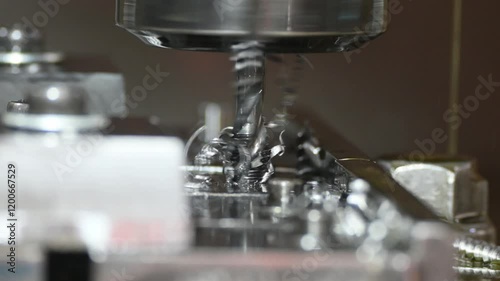 Zoom out scene the thread making process by tapping tool on CNC milling machine.