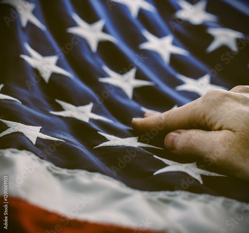 hand resting on United States flag american red white blue stripes and stars patriotic abstract honor reverence elegant abstract macro retro vintage close-up background