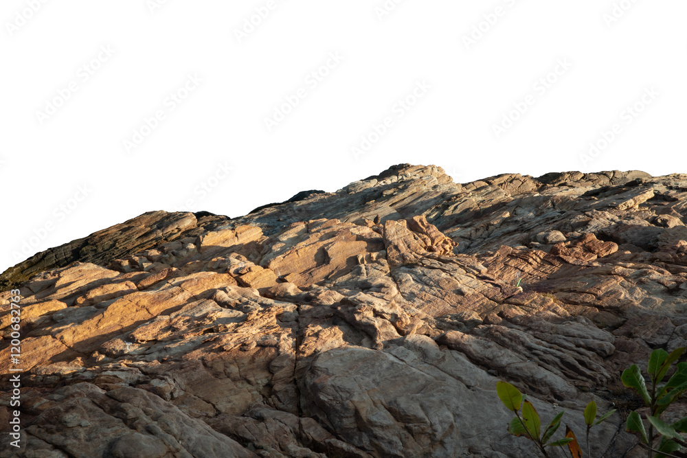 A sunlit rock cliff isolated against a white background. The sun casts warm tones and shadows across the rocky surface, highlighting its layered texture and natural beauty A sunlit rock cliff isolated against a white background. The sun casts warm tones and shadows across the rocky surface, highlighting its layered texture and natural beauty