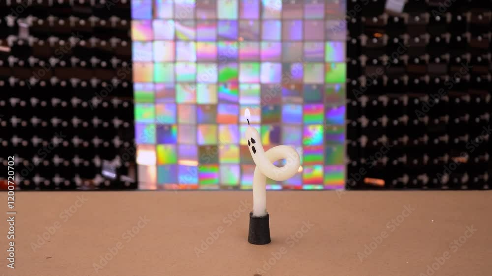 Lighting bendy candle with painted ghost face for Halloween decoration