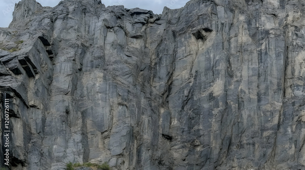 Imposing Dark Gray Rock Face Towers with Rugged Texture and Vertical Lines Imposing Dark Gray Rock Face Towers with Rugged Texture and Vertical Lines