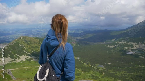 Tranquility in the Heights: Woman Admiring the Scenery of Tatra National Park in Poland