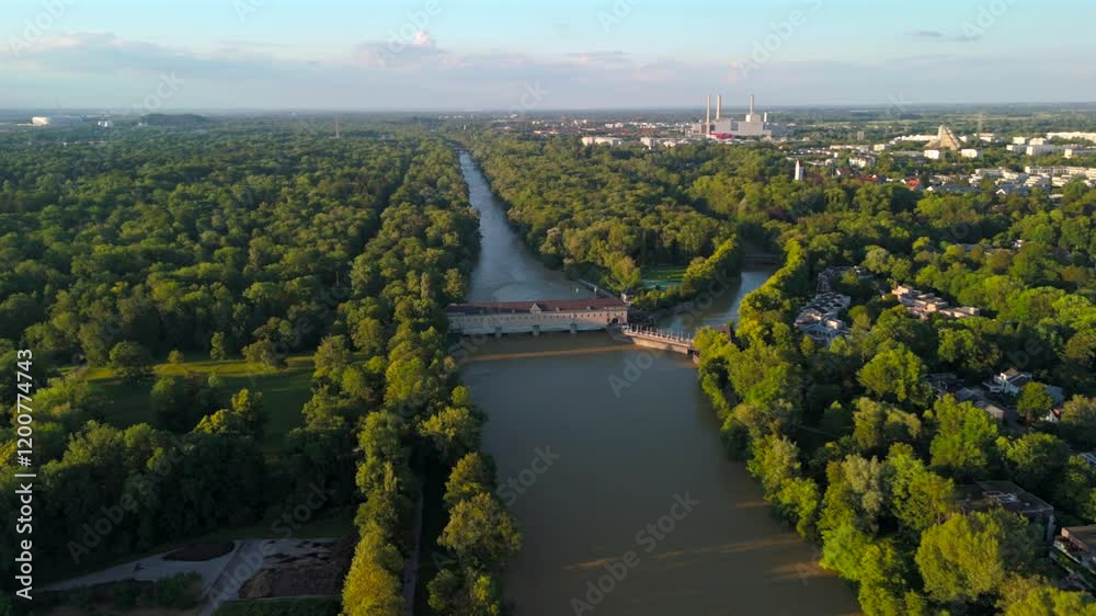 Stauwehr Oberfoehring Muenchen, Bayern, Deutschland Luftaufnahme im Sommer. Dam on Isar River in Munich, Germany aerial view in summer. Top view of the English Garden and the dam on the River Isar. 