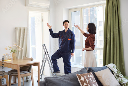 Handyman fixing the air conditioner