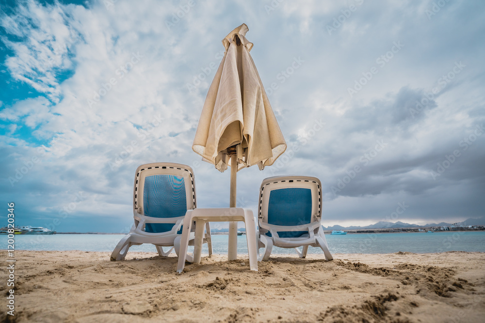 Fototapeta premium beach chairs and umbrellas on the beach