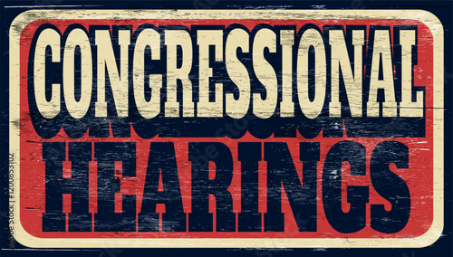 Aged and worn congressional hearings sign on wood 