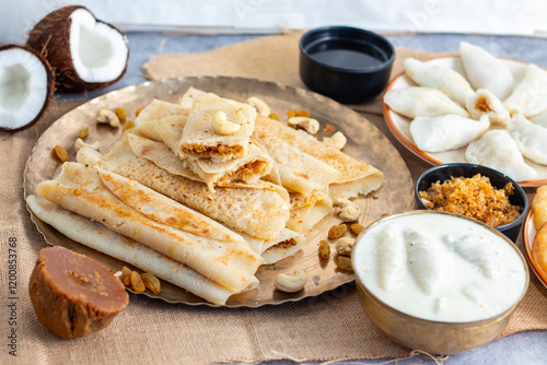 Pitha Pulli is a traditional Bengali sweet made with rice flour, jaggery, coconut, and spices, often steamed or fried. photo