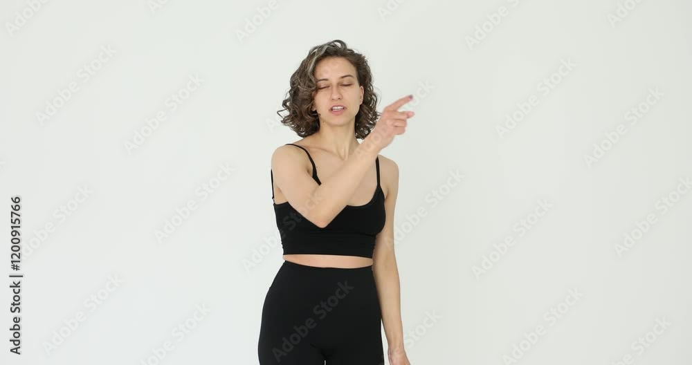 I choose you smiling woman pointing finger at camera and looking with playful happy expression on white background I choose you smiling woman pointing finger at camera and looking with playful happy expression on white background