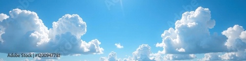 Vast blue summer sky dotted with billowing white clouds, sunlight reflecting brilliantly , serene, sky, freedom photo