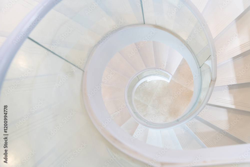 Fototapeta premium Beautiful white spiral staircase in the building