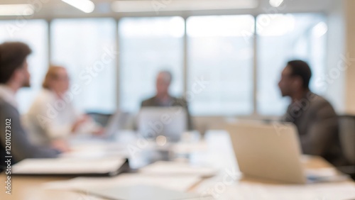 A blurred scene of executives discussing strategy.