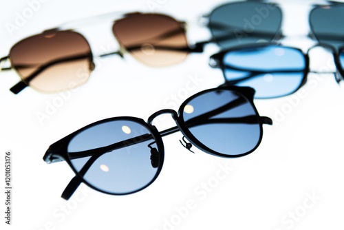 Many sunglasses are displayed in the store