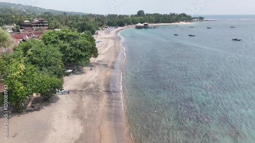 Relaxing view of calm sea and Senggigi Beach, summer sunny day in Lombok Island, indonesia. photo