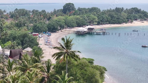 Amazing aerial of Senggigi Beach over palm tree. Tropical coastal of Lombok, Indonesia. photo