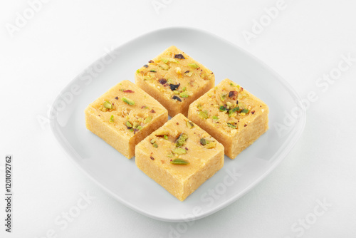 SOAN PAPDI also known as san papri, shompapri, sohan papdi, shonpapdi is a popular dessert in the Indian subcontinent. It is made of gram flour (besan), all-purpose flour, ghee, sugar and milk.