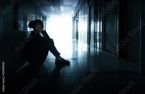 Wallpaper Mural Depressed woman sitting on the hallway floor Torontodigital.ca