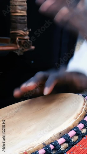 Close up of an African drummer. Drummer playing African percussion music.	