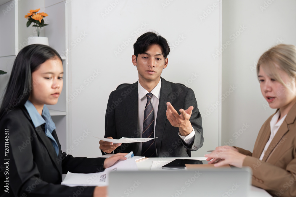 Business Team Collaborating in Modern Office Setting for Innovative Idea Exchange and Strategic Planning