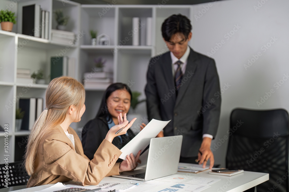 Dynamic Business Team Engaged in a Productive Meeting, Sharing Innovative Ideas and Strategies in a Modern Office Environment Dynamic Business Team Engaged in a Productive Meeting, Sharing Innovative Ideas and Strategies in a Modern Office Environment