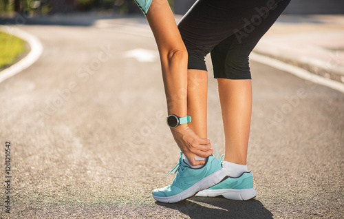Fototapeta Naklejka Na Ścianę i Meble -  Runner sport knee injury. Woman in knee pain while running work out in park. Health care concept.