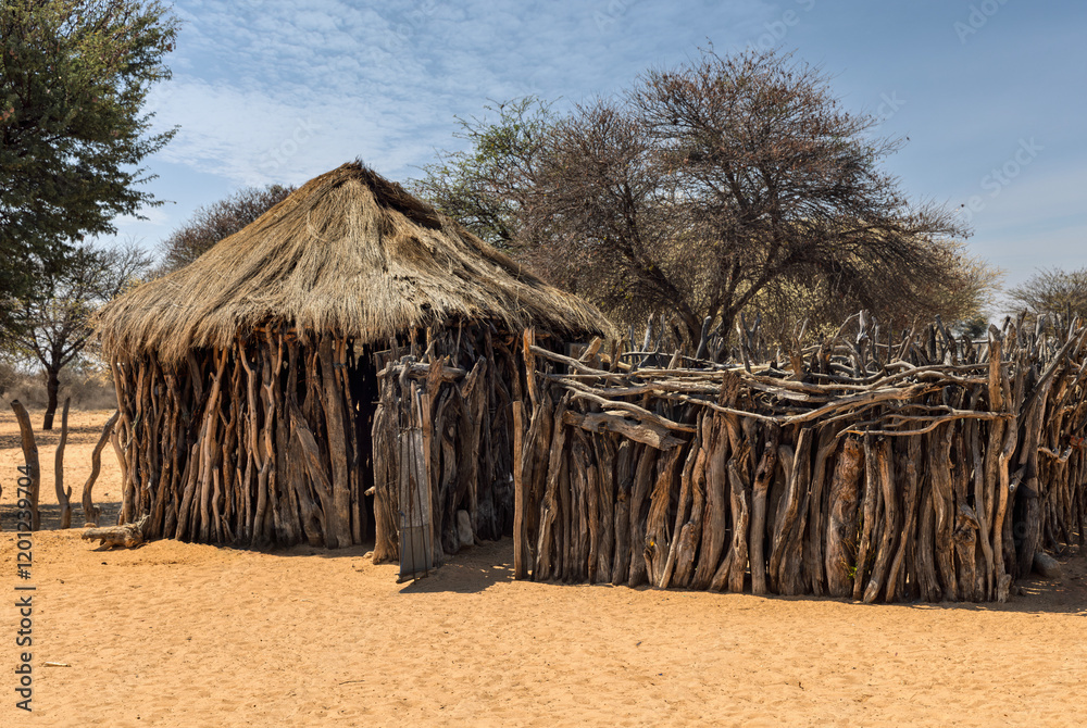 hut rondavel wood wall and fence with thatched roof, in African village, typical rural architecture in southern africa bush hut rondavel wood wall and fence with thatched roof, in African village, typical rural architecture in southern africa bush