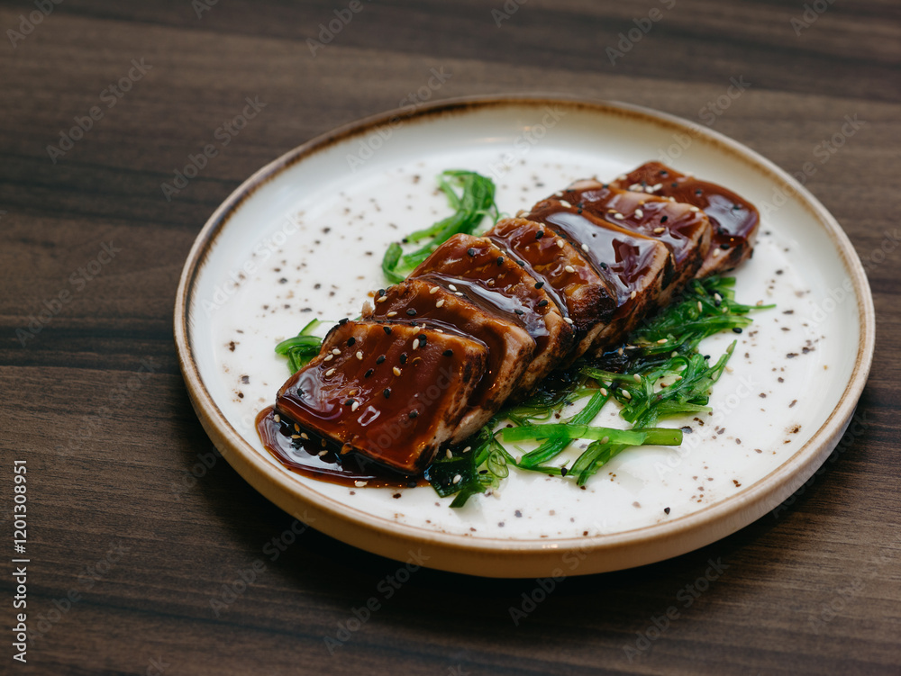 Tuna tataki with wakame and teriyaki sauce in luxury restaurant Tuna tataki with wakame and teriyaki sauce in luxury restaurant