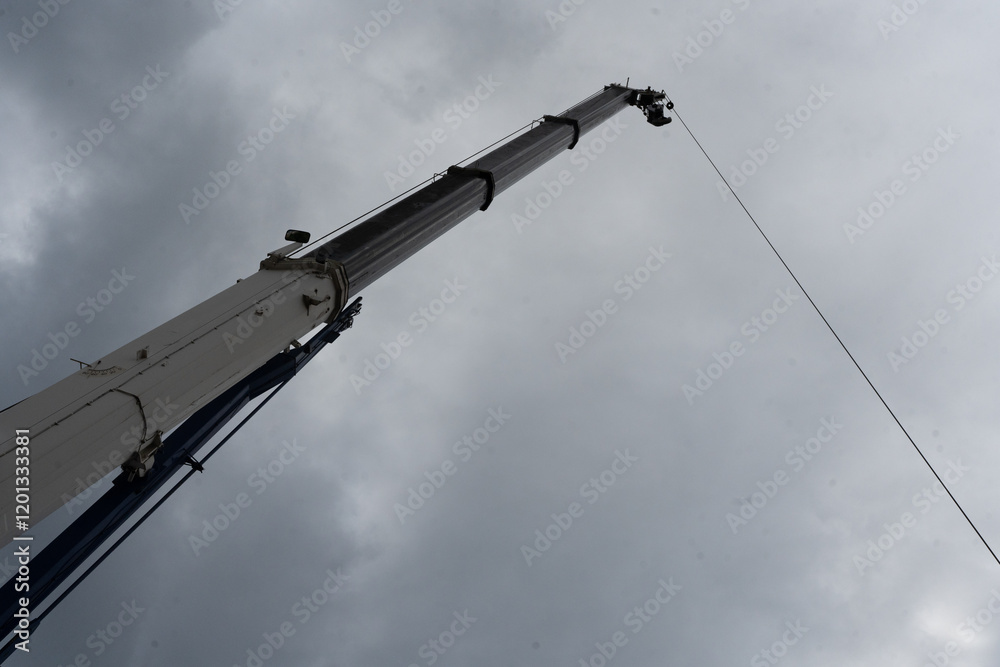 Large industrial crane masts at construction site Large industrial crane masts at construction site