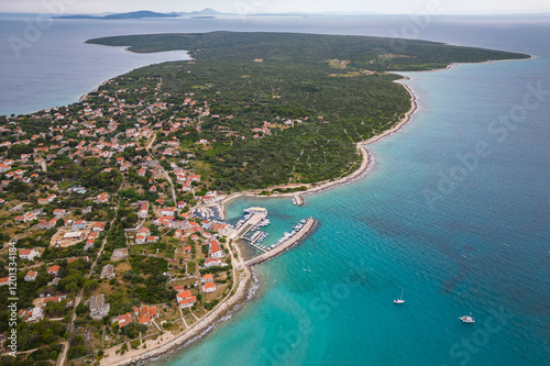 Aerial drone view of Croatian island Silba with beautiful beaches. Amazing Adriatic sea tourist vacation destination in Croatia. Panoramic paradise blue sea, sandy beaches, old houses and boats
