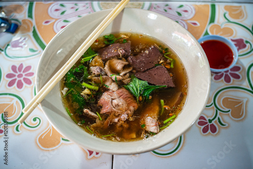 Famous Thai - Chinese Food - Clear Soup with congealed pork blood 
and minced pork together with streamed rice photo